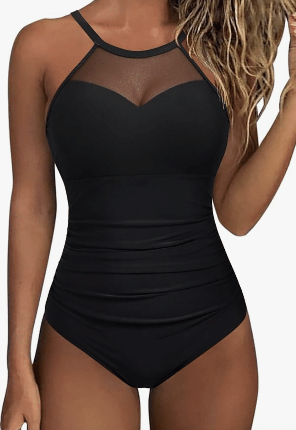 Picture of a woman wearing a black one piece swim suit with mesh at the top.